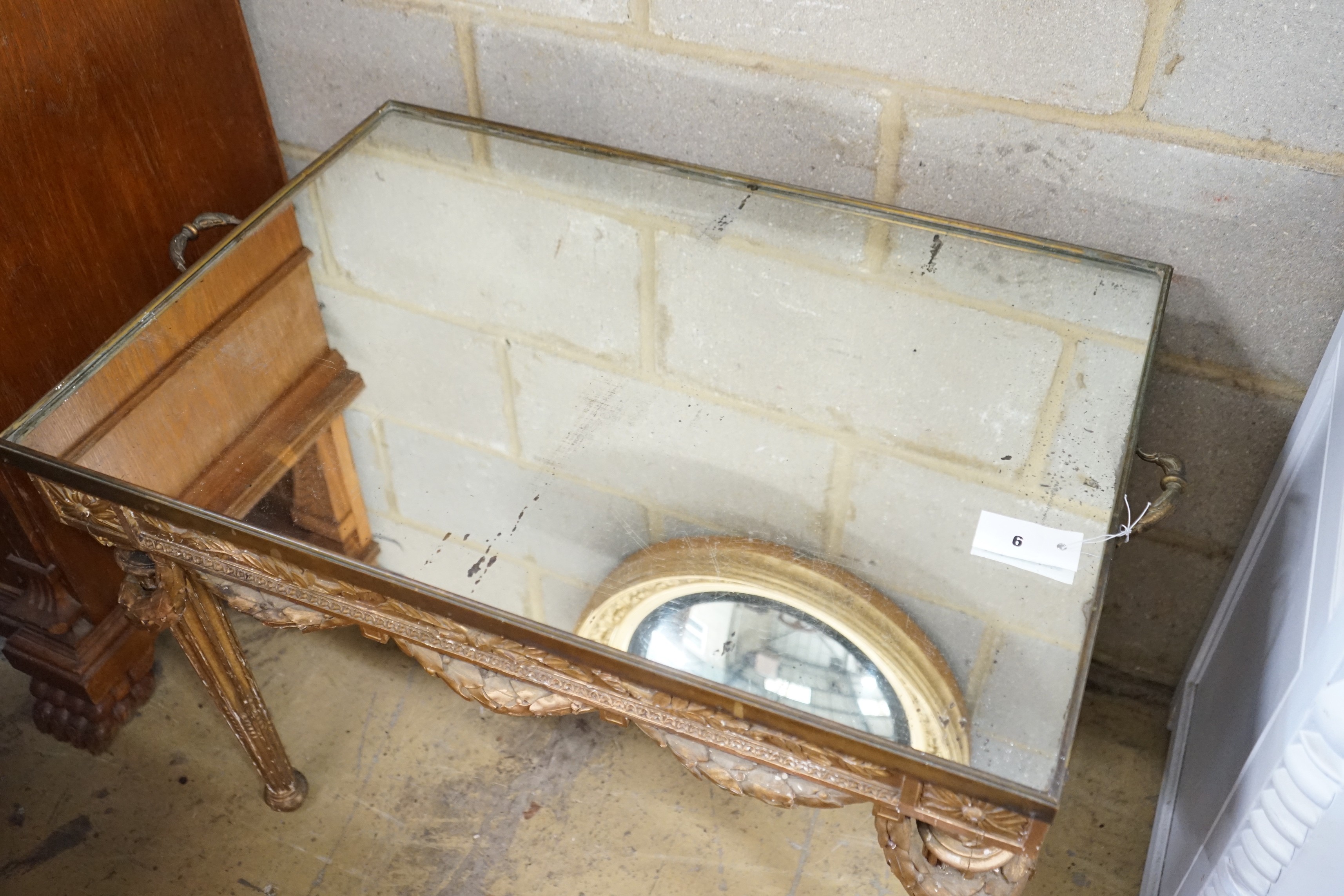 An 18th century style rectangular giltwood and gesso mirrored tray top table, width 80cm, depth 56cm, height 61cm